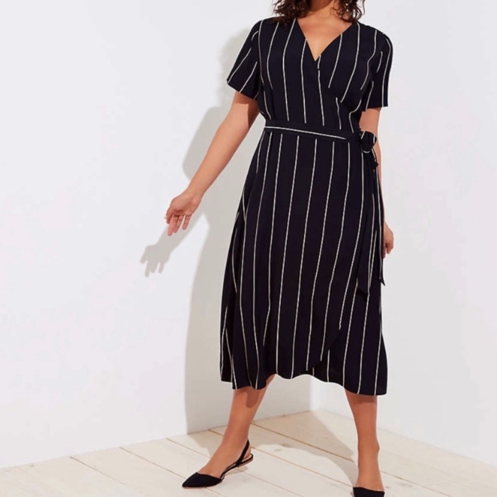 Black and cream pinstripe wrap dress with tulip hem.